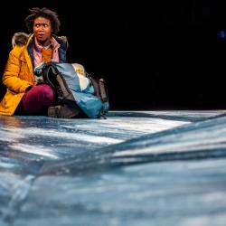 Satchel Williams going through supplies in a production image for A Hundred Words for Snow. Photo: Ashley Smith of Wide Eyed Studios.